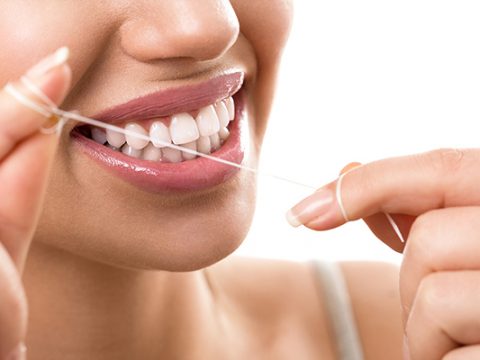 closeup the importance of flossing