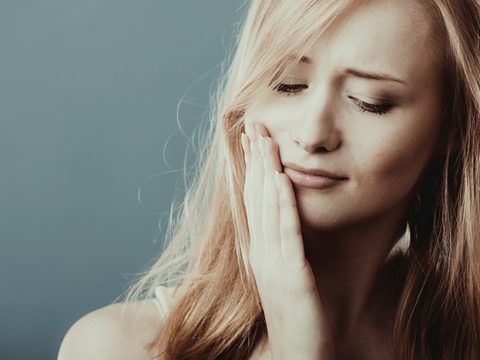 woman with tooth sensitivity
