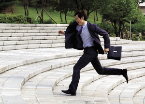 busy businessman dental patient running to appointment