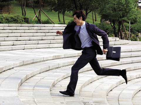 busy businessman dental patient running to appointment